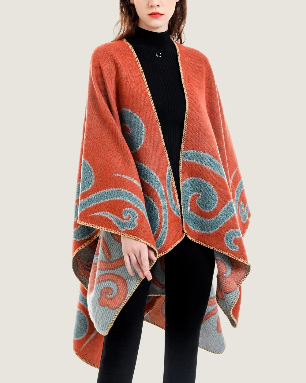 poncho-cape-femme-motif-spirales-orange