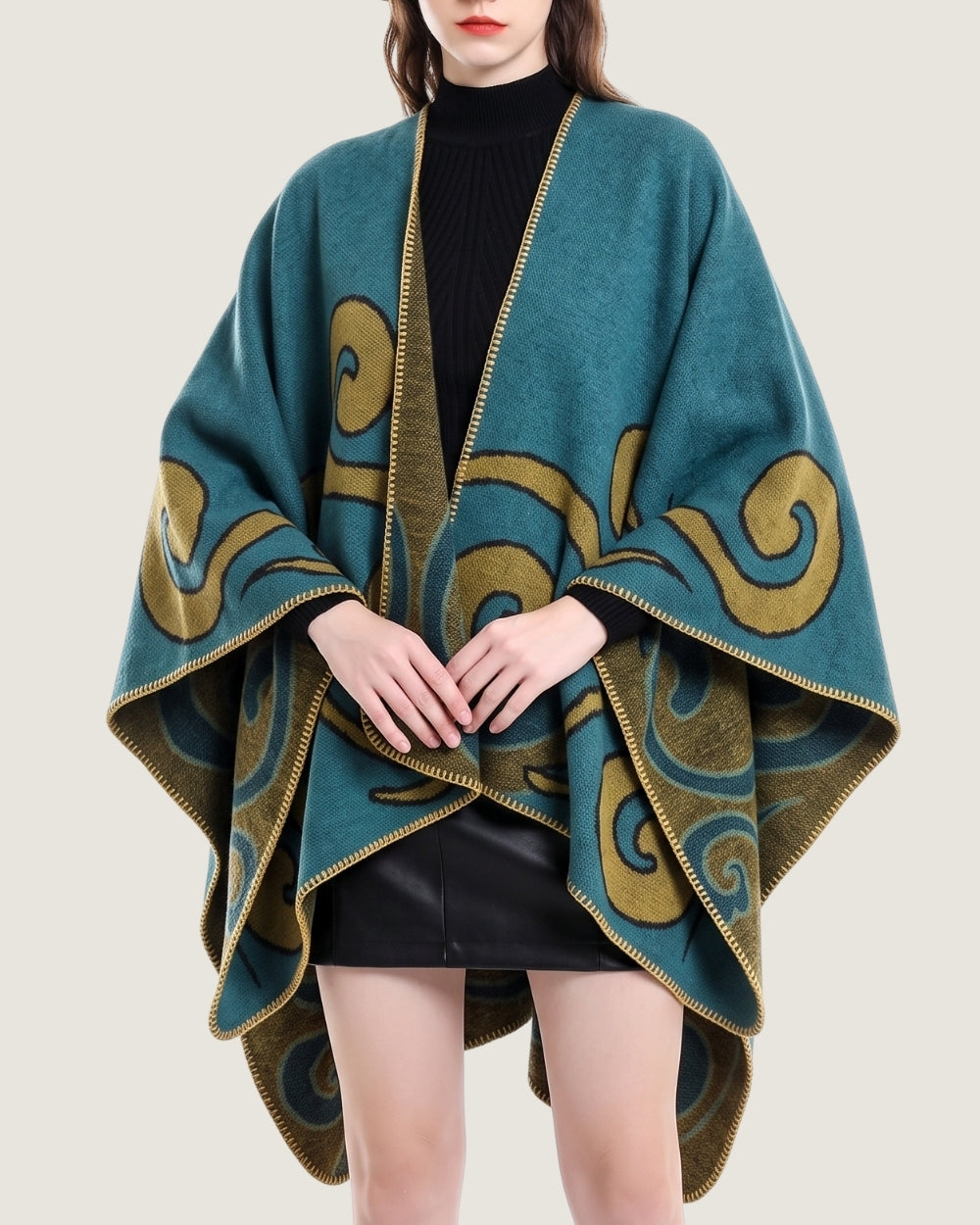 poncho-cape-femme-motif-spirales-turquoise
